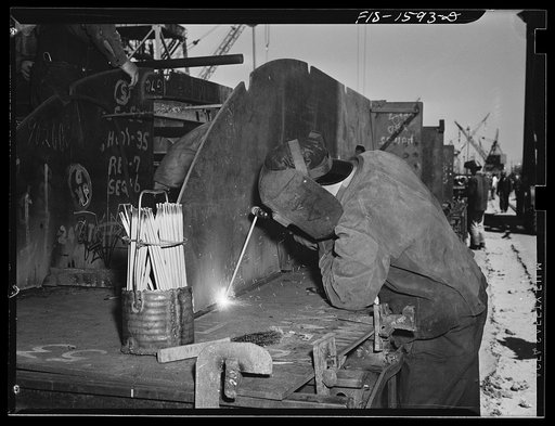 California Shipbuilding Corporation, Wilmington, California. Welder working on a double bottom section