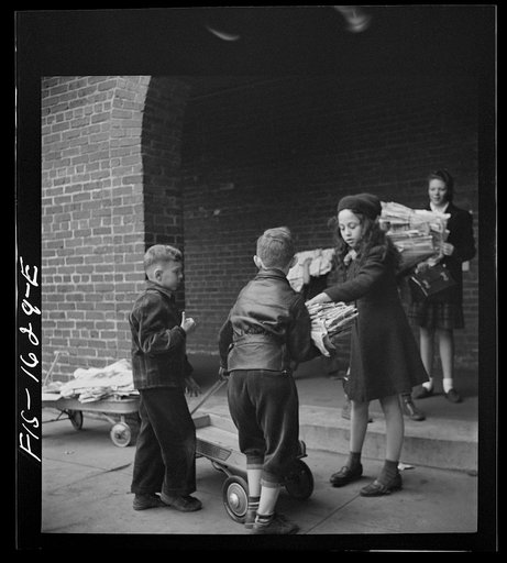 Untitled photo, possibly related to: Washington, D.C. Scrap salvage campaign, Victory Program. Children bringing their weekly contribution of scrap paper to school