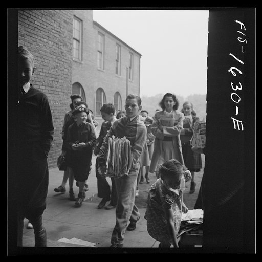 Untitled photo, possibly related to: Wa]shington, D.C. Scrap salvage campaign, Victory Program. Children bringing their weekly contribution of scrap paper to school