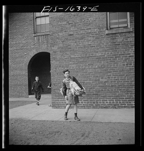 Untitled photo, possibly related to: Washington, D.C. Scrap salvage campaign, Victory Program. Children bringing their weekly contribution of scrap paper to school