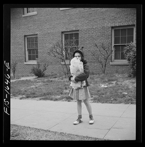 Untitled photo, possibly related to: Washington, D.C. Scrap salvage campaign, Victory Program. Washington schoolchild brings a load of scrap paper to school once a week. Here it is collected by paper company truck
