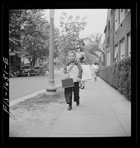 Untitled photo, possibly related to: Washington, D.C. Scrap salvage campaign, Victory Program. Children bringing their weekly contribution of scrap paper to school