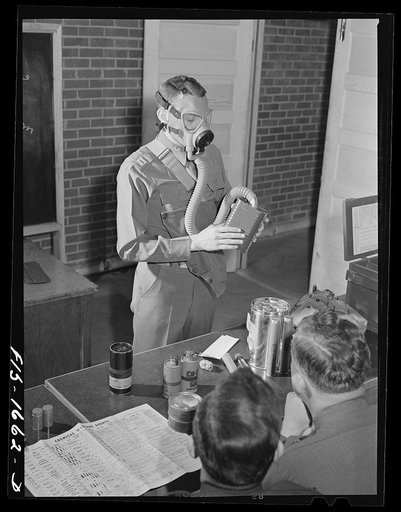Captain William W. Kitchen instructing a U.S. Army chaplain school class in gas warfare and the use of gas masks. Fort Benjamin Harrison, Indiana