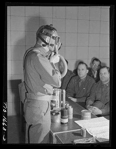 Captain William W. Kitchen instructing chaplain school class in gas warfare and the use of gas masks. U.S. Army chaplain school, Fort Benjamin Harrison, Indiana