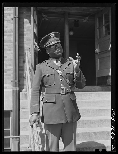Untitled photo, possibly related to: Chaplain George W. Williams, addressing students at a Negro elementary school in Indianapolis. Chaplain Williams comes from Sumter, South Carolina, where his father is a minister
