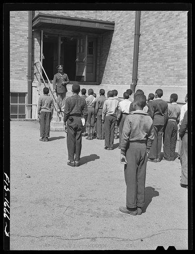 School children at a grammar school in Indianapolis listening to a speech by Chaplain George Washington Williams, who is just graduating from the U.S. Army chaplain school. Fort Benjamin Harrison, Indiana