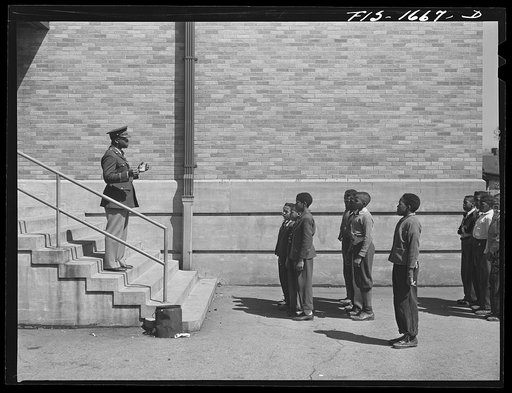 School children at a grammar school in Indianapolis listening to a speech by Chaplain George Washington Williams, who is just graduating from the U.S. Army chaplain school. Fort Benjamin Harrison, Indiana