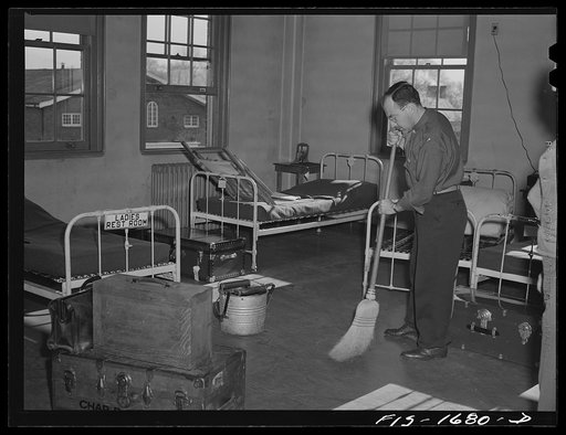Chaplain David Rubin taking his turn at cleaning and sweeping the chaplains' quarters. Chaplain Rubin is of the Orthodox Jewish faith, and comes from Long Island, New York. U.S. Army chaplain school, Fort Benjamin Harrison, Indiana