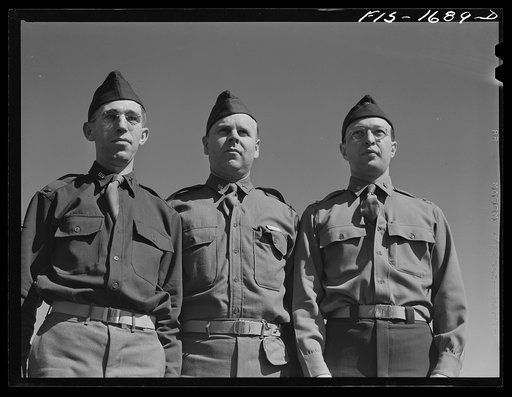 Chaplain Fred W. Thissen, Catholic (left), Chaplain Ernest Pine, Protestant (center), and Chaplain Jacob Rothschild, Jewish (right), students at the U.S. Army chaplain school. Fort Benjamin Harrison, Indiana