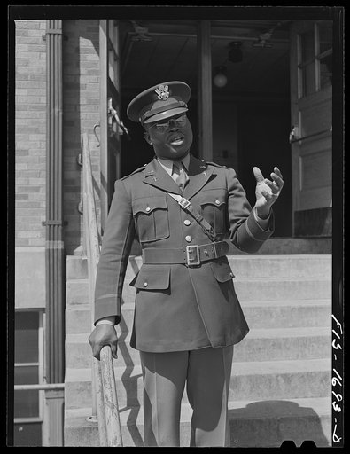 Chaplain George W. Williams, addressing students at a Negro elementary school in Indianapolis. Chaplain Williams comes from Sumter, South Carolina, where his father is a minister. U.S. Army chaplain school, Fort Benjamin Harrison, Indiana