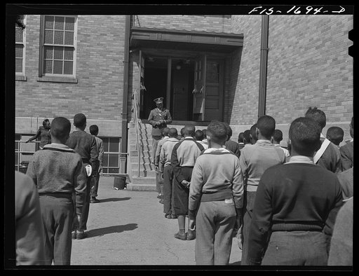 Untitled photo, possibly related to: School children at a grammar school in Indianapolis listening to a speech by Chaplain George Washington Williams, who is just graduating from the U.S. Army chaplain school. Fort Benjamin Harrison, Indiana