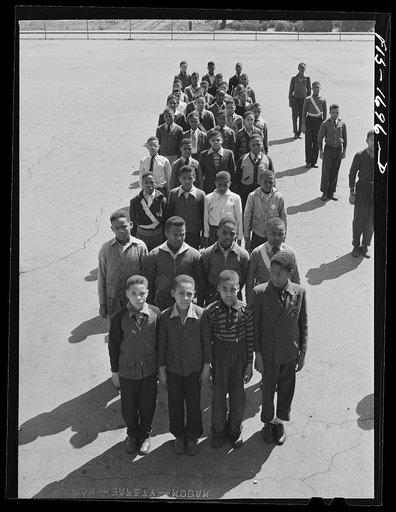 Untitled photo, possibly related to: School children at a grammar school in Indianapolis listening to a speech by Chaplain George Washington Williams, who is just graduating from the U.S. Army chaplain school. Fort Benjamin Harrison, Indiana