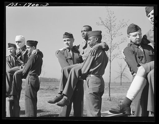 Untitled photo, possibly related to: A first aid class at the chaplain school, learning the proper methods of carrying the wounded. U.S. Army chaplain school, Fort Benjamin Harrison, Indiana