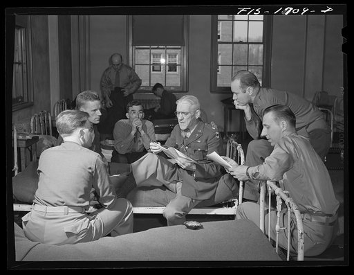 Chaplain (Lieutenant Colonel) Paul B. Rupp discussing problems these newly graduated chaplains will encounter under actual war conditions. U.S Army chaplain school, Fort Benjamin Harrison, Indiana