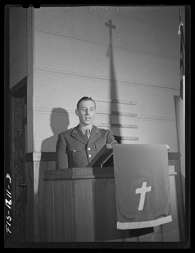 Chaplain Martin J. Stein, Lutheran, from Minneapolis, Minnesota conducting services at the army post chapel. Fort Benjamin Harrison, Indiana