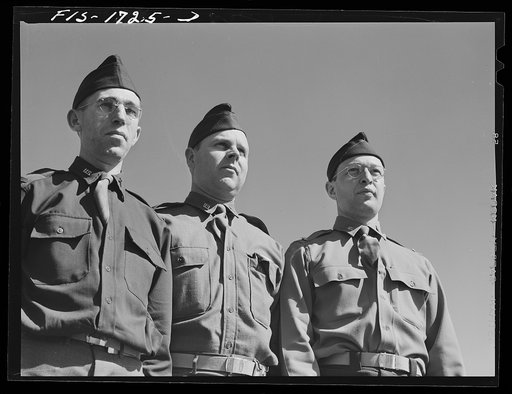 Chaplain Fred W. Thissen, Catholic (left), Chaplain Ernest Pine, Protestant (center), and Chaplain Jacob Rothschild, Jewish (right), students at the U.S. Army chaplain school. Fort Benjamin Harrison, Indiana