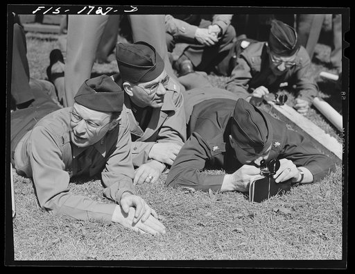 Chaplains Jacob Rothschild, left, Harold Elsam and P.M. Hickcox, right, learning to use instruments in a map reading class at the U.S. Army chaplain school. Fort Benjamin Harrison, Indiana