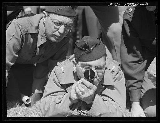 Chaplains Jacob Rothschild and Harold Elsam learning to use instruments in a map reading class at the U.S. Army chaplain school. Fort Benjamin Harrison, Indiana