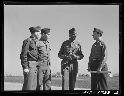 Chaplains Fred W. Thissen, Catholic, from New Ulm, Minnesota; Ernest F. Pine, Protestant, from Hynes, California; Samuel A. Owen, Negro Baptist, from Memphis, Tennessee; and Jacob Rothschild, Jewish, from Pittsburgh, Pennsylvania discussing problems of their map reading class at the U.S. Army chapla