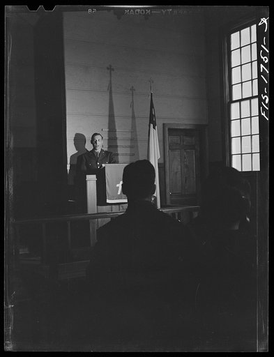 Chaplain Martin J. Stein, Lutheran, from Minneapolis, Minnesota conducting services at the army post chapel. Fort Benjamin Harrison, Indiana