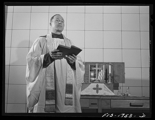Chaplain P.S. Hall, Episcopalian, of Upper Darby, Pennsylvania, saying mass at the U.S. Army chaplain school. Fort Benjamin Harrison, Indiana