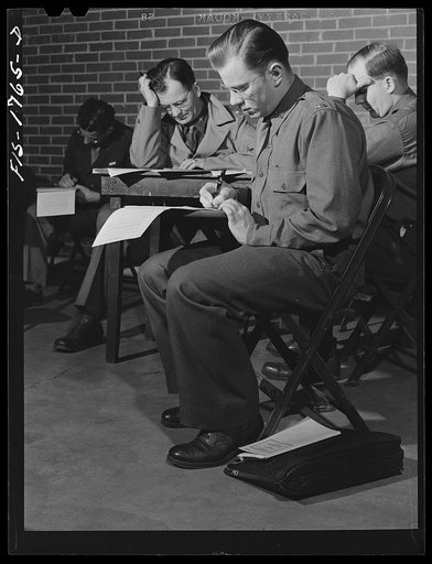 Chaplain William H. Beeby, youngest chaplain at the school, age twenty-six, taking a final examination. U.S. Army chaplain school at Fort Benjamin Harrison, Indiana