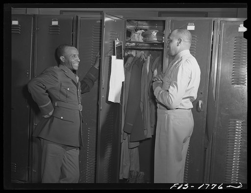 Chaplain Joseph R. Middleton, Methodist, of Chicago, Illinois and Chaplain Samuel A. Owen, Baptist, of Memphis, Tennessee. Clothes in the locker must be arranged according to strict army regulations. U.S. Army chaplain school, Fort Benjamin Harrison, Indiana