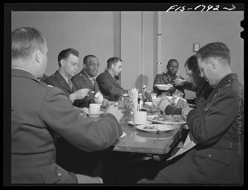 Chaplains having lunch around the mess table. U.S. Army chaplain school, Fort Benjamin Harrison, Indiana