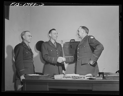 Chaplains Martin J. Stein and Thadieth Son of Brownwood, Texas, saying goodbye to Chaplain William D. Cleary, Commandant of the U.S. Army chaplain school. Fort Benjamin Harrison, Indiana