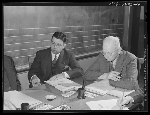 Mr. A.J. Oliveira, left, at a meeting of the school board of which he is a member. San Leandro, California