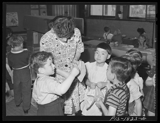 San Leandro, California. Kindergarten children and their teacher. About seventy percent of the school children in this community are of Portuguese descent. Their schoolmates are of Spanish, Italian, English, German, Mexican, Chinese and Japanese descent