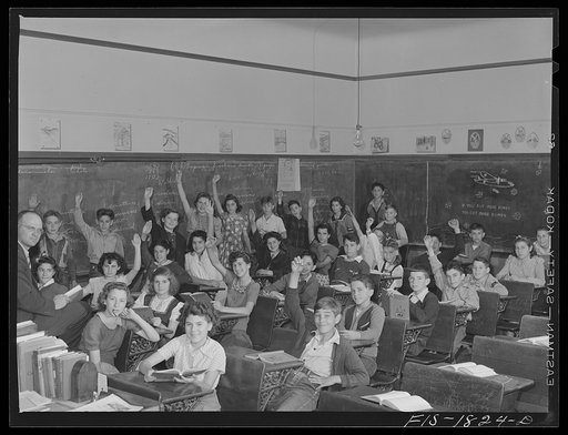 Untitled photo, possibly related to: Classroom in a grade school of San Leandro, California. All children with their hands raised are of Portuguese descent, and are proud of it