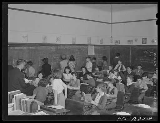 Untitled photo, possibly related to: Classroom in a grade school of San Leandro, California. All children with their hands raised are of Portuguese descent, and are proud of it