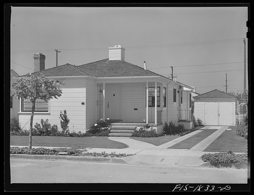 Typical home of San Leandro, California. Notice the block warden sign in the front window. The civilian defense activities have been well organized, and people of Portuguese blood have been quick to volunteer their services
