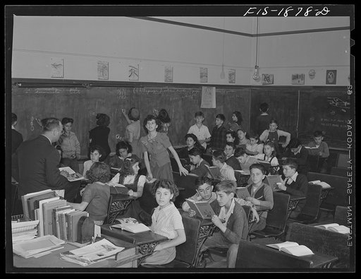 Untitled photo, possibly related to: Classroom in a grade school of San Leandro, California. All children with their hands raised are of Portuguese descent, and are proud of it