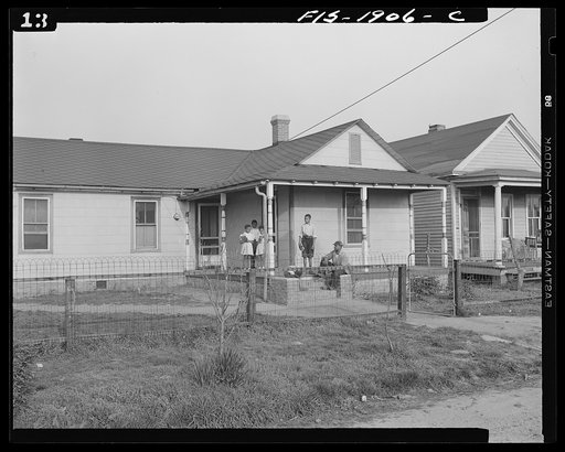 Newport News, Virginia. Negro shipyard worker shown at his rural home with four of his children