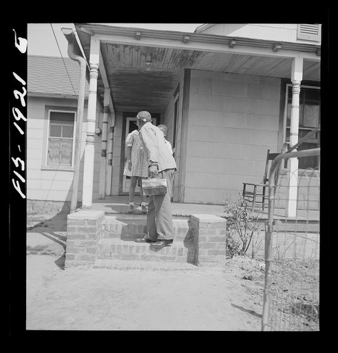 Untitled photo, possibly related to: Newport News, Virginia. Negro shipyard worker leaving his rural home for the shipyards with his lunch box