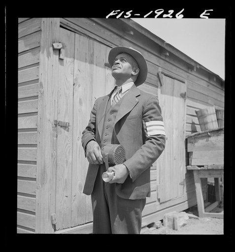 Newport News, Virginia. Negro shipyard worker does volunteer duty as an air raid warden