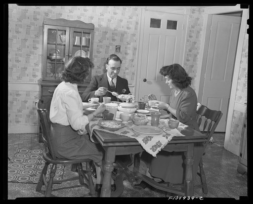 Provincetown, Massachusetts. John Russe, Jr., captain and owner of the drag trawler Frances and Marion at dinner with his wife and sister-in-law