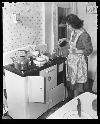 Provincetown, Massachusetts. Wife of John Russe, Jr., a Portuguese fisherman, preparing dinner