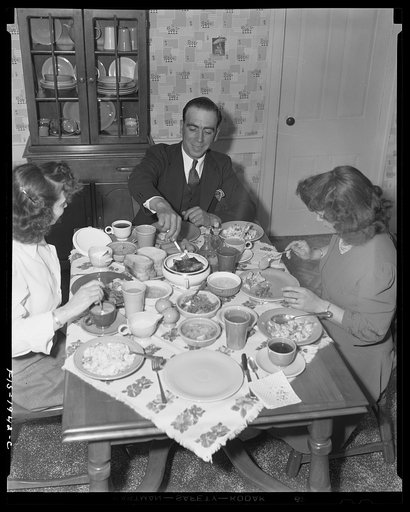 Untitled photo, possibly related to: Provincetown, Massachusetts. John Russe, Jr., captain and owner of the drag trawler Frances and Marion at dinner with his wife and sister-in-law