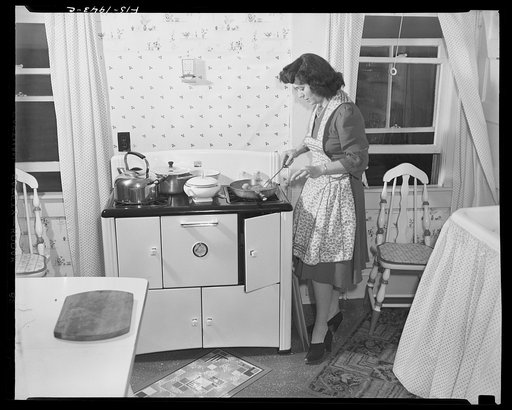 Provincetown, Massachusetts. Wife of John Russe, Jr., a Portuguese fisherman, preparing dinner