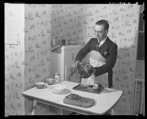 Untitled photo, possibly related to: Provincetown, Massachusetts. John Russe, Jr., a Portuguese fisherman, and his wife preparing a lobster and coffee for dinner