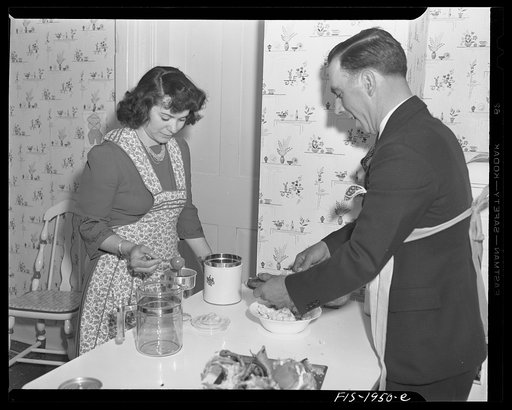 Provincetown, Massachusetts. John Russe, Jr., a Portuguese fisherman, and his wife preparing a lobster and coffee for dinner