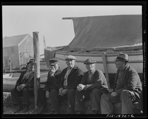 Untitled photo, possibly related to: Provincetown, Massachusetts. Portuguese workmen building a cabin on an open dory