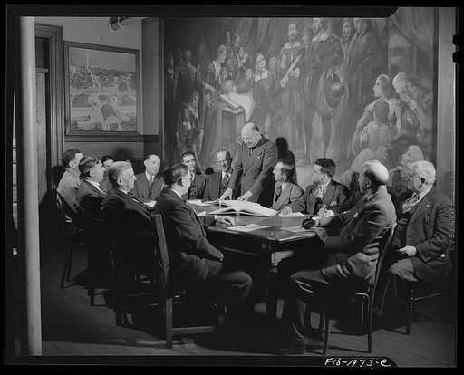 Untitled photo, possibly related to: Provincetown, Massachusetts. City fathers of Provincetown, all of Portuguese descent, gathered in council, before a painting representing the signing of the Pilgrim compact in the bay of Provincetown upon the first landing of the Pilgrims on American soil