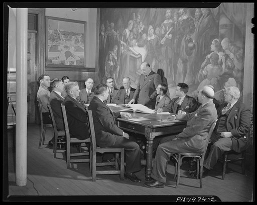 Provincetown, Massachusetts. City fathers of Provincetown, all of Portuguese descent, gathered in council, before a painting representing the signing of the Pilgrim compact in the bay of Provincetown upon the first landing of the Pilgrims on American soil