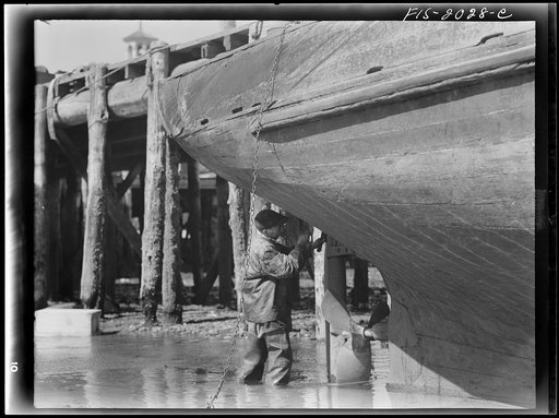 Untitled photo, possibly related to: Provincetown, Massachusetts. The Frances and Marion, a Portuguese trawler, beached for repairs