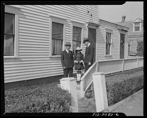 Untitled photo, possibly related to: Provincetown, Massachusetts. Portuguese dory fisherman and his wife and granddaughter on their way to Massachusetts