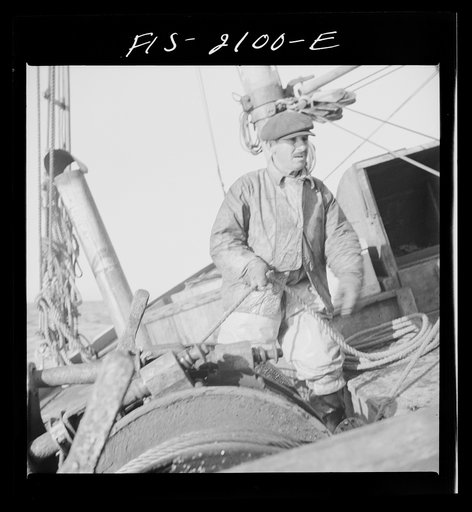 Provincetown, Massachusetts. Aboard the Frances and Marion, a Portuguese drag trawler off Cape Cod. Winchman slacking off the trawl